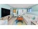 Spacious living room with comfortable seating, water views, and coastal-inspired accents for relaxed living at 2955 N Beach Rd # D123, Englewood, FL 34223