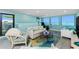 Cozy living room featuring scenic water views, comfortable seating, and unique accents for relaxed living at 2955 N Beach Rd # D123, Englewood, FL 34223