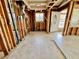 Interior space with studs, neutral tile floor and an inviting entrance, offering great potential for customization at 2985 N Beach Rd # Bv-5, Englewood, FL 34223