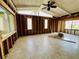 Bright living room with vaulted ceilings, large windows, and walls down to the studs awaiting customization at 2985 N Beach Rd # Bv-5, Englewood, FL 34223