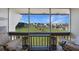A tranquil view of manicured lawn and boats from the unit's inviting balcony at 311 Garvin St # 209C, Punta Gorda, FL 33950