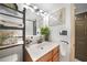 Bathroom features a single sink vanity, decorative mirror, and natural light at 311 Garvin St # 209C, Punta Gorda, FL 33950
