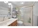 Bright bathroom with a glass shower, modern fixtures and a rack for towels and decor at 311 Garvin St # 209C, Punta Gorda, FL 33950