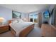 Comfortable bedroom with a large window, neutral carpet, and soothing light blue paint at 311 Garvin St # 209C, Punta Gorda, FL 33950