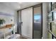 Bright foyer with white door, side glass panels, and tile floors for a clean entry at 311 Garvin St # 209C, Punta Gorda, FL 33950