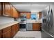Well-equipped kitchen features stainless steel appliances and wood cabinetry at 311 Garvin St # 209C, Punta Gorda, FL 33950