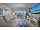 Inviting living room with waterfront views from the balcony, featuring comfortable seating at 311 Garvin St # 209C, Punta Gorda, FL 33950