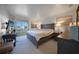 Well-lit main bedroom features a private balcony, neutral carpeting, and an ensuite bathroom at 311 Garvin St # 209C, Punta Gorda, FL 33950