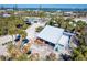 Aerial view of the home exterior with a large yard and surrounding neighborhood at 4078 N Beach Rd, Englewood, FL 34223