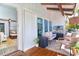 View of the wooden deck featuring a seating area and tv at 4078 N Beach Rd, Englewood, FL 34223