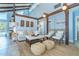 Cozy living room with comfortable seating, neutral tones, and ample natural light at 4078 N Beach Rd, Englewood, FL 34223