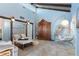 Charming living room with vaulted ceilings, exposed beams, and tile floors at 4078 N Beach Rd, Englewood, FL 34223