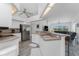 Open kitchen with stainless steel appliances and an eat-in bar area at 431 Rotonda Cir, Rotonda West, FL 33947