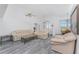 Bright living room with high ceilings, ceiling fan, wood-look floors and neutral paint at 431 Rotonda Cir, Rotonda West, FL 33947