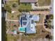 Stunning aerial view of the home featuring a pool, deck, and solar panels, showcasing its modern amenities at 50 Spyglass Aly, Placida, FL 33946