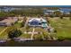 Stunning aerial view showcasing a one-story waterfront home with a private dock, pool, and lush landscaping at 50 Spyglass Aly, Placida, FL 33946