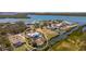 Beautiful waterfront property with a pool and private dock on a sunny day at 50 Spyglass Aly, Placida, FL 33946