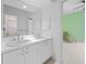 Bathroom with double sink vanity at 50 Spyglass Aly, Placida, FL 33946