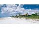Relaxing beachside retreat with beautiful water, light sand, and vegetation, creating a serene coastal escape at 50 Spyglass Aly, Placida, FL 33946