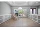 A bright bonus room with shelving and a large window with plantation shutters at 50 Spyglass Aly, Placida, FL 33946