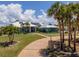 Beautiful exterior of home with lush landscaping and mature palm trees at 50 Spyglass Aly, Placida, FL 33946
