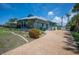 Charming one-story home with two-car garage, beautiful landscaping, and a well-maintained lawn at 50 Spyglass Aly, Placida, FL 33946