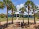 Beautiful exterior of home with lush landscaping and mature palm trees at 50 Spyglass Aly, Placida, FL 33946