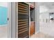 Large wine fridge and custom bar located off hallway at 50 Spyglass Aly, Placida, FL 33946
