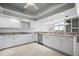 Bright kitchen featuring recessed lighting, tile floors, and white cabinetry and countertops at 50 Spyglass Aly, Placida, FL 33946