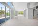 Bright, open-plan living room features sliding glass doors to a covered patio at 50 Spyglass Aly, Placida, FL 33946