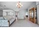 The living room featuring a chandelier, tile flooring, and a glass-topped end table at 50 Spyglass Aly, Placida, FL 33946