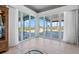 A living space featuring tile floors and sliding glass doors overlooking the pool at 50 Spyglass Aly, Placida, FL 33946