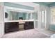 Spacious main bathroom features double vanity, walk in shower, and tile floors at 50 Spyglass Aly, Placida, FL 33946