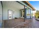 Covered outdoor patio showcasing the home's exterior and adjacent hot tub and outdoor space at 50 Spyglass Aly, Placida, FL 33946