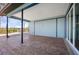 Covered outdoor patio showcasing the home's exterior with a view of the backyard at 50 Spyglass Aly, Placida, FL 33946