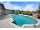 Backyard pool with patio, landscaping and view of the home's exterior, and clear blue sky at 50 Spyglass Aly, Placida, FL 33946