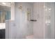Shower features tile walls, shower head, and shelf at 50 Spyglass Aly, Placida, FL 33946