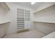 Spacious walk-in closet featuring built in shelving, drawers, and clothing rods at 50 Spyglass Aly, Placida, FL 33946