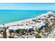 An aerial view of condos along a white sand beach with turquoise waters at 5000 Gasparilla Rd # 41B, Boca Grande, FL 33921