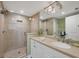 Well-lit bathroom with a glass-enclosed shower, neutral tones, and a vanity with ample storage at 5000 Gasparilla Rd # 41B, Boca Grande, FL 33921