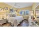 Bright bedroom features a comfortable bed, wicker accents, and plantation shutters at 5000 Gasparilla Rd # 41B, Boca Grande, FL 33921