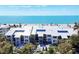 Beachfront condo building with lush landscaping and ocean view at 5000 Gasparilla Rd # 41B, Boca Grande, FL 33921