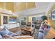 Bright living room boasts comfortable seating, built-in shelving, and stunning beach views at 5000 Gasparilla Rd # 41B, Boca Grande, FL 33921