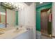 Well-lit bathroom with a large vanity, sink, and walk-in shower, combining functionality with a clean, inviting design at 5000 Gasparilla Rd # Vh37, Boca Grande, FL 33921