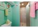 Refreshing bathroom with a tiled shower and light green walls, creating a clean and serene space at 5000 Gasparilla Rd # Vh37, Boca Grande, FL 33921