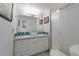 Bright bathroom with a glass bowl sink, white cabinets, and a tiled shower, offering a refreshing and clean space at 5000 Gasparilla Rd # Vh37, Boca Grande, FL 33921