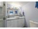 Elegant bathroom with a vessel sink, white cabinets, and a glass-enclosed shower, combining style and functionality at 5000 Gasparilla Rd # Vh37, Boca Grande, FL 33921