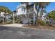 Coastal home with palm trees, a garage, and a rooftop deck offers a relaxed beach lifestyle at 5000 Gasparilla Rd # Vh37, Boca Grande, FL 33921