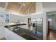 This home's kitchen features granite counters, stainless steel appliances and white cabinetry at 5000 Gasparilla Rd # Vh37, Boca Grande, FL 33921