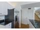 The kitchen features granite countertops, stainless steel appliances, and white cabinets, conveniently near the stairs at 5000 Gasparilla Rd # Vh37, Boca Grande, FL 33921